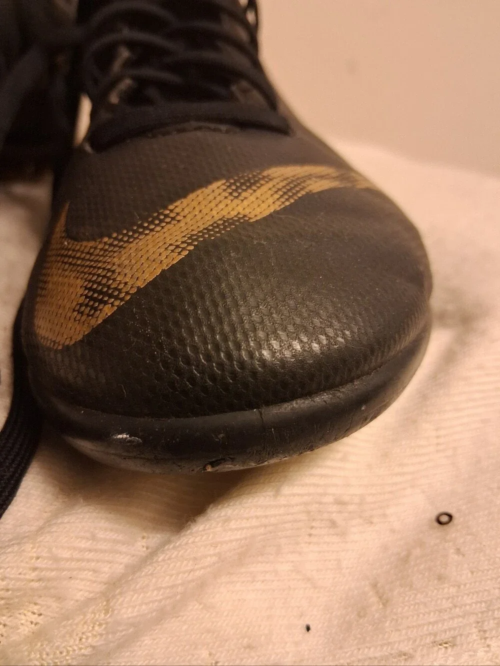 Youth Nike Black Cleats with Gold Swoosh Size 5Y
